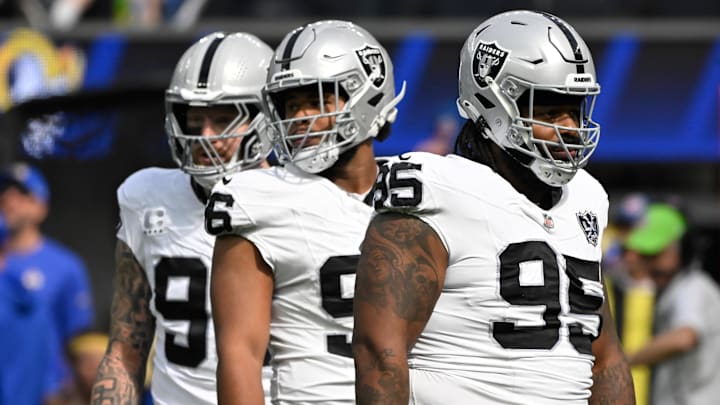 Oct 20, 2024; Inglewood, California, USA; Las Vegas Raiders defensive linemen Maxx Crosby (98), Jonah Laulu (96) and John Jenkins (95)  at SoFi Stadium. Mandatory Credit: Robert Hanashiro-Imagn Images