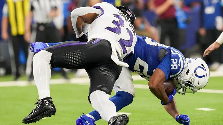Baltimore Ravens linebacker Trenton Simpson (32) tackles Indianapolis Colts running back Jonathan Taylor (28) on Sunday, Sept. 13, 2026, during a game against the Baltimore Ravens at Lucas Oil Stadium in Indianapolis.