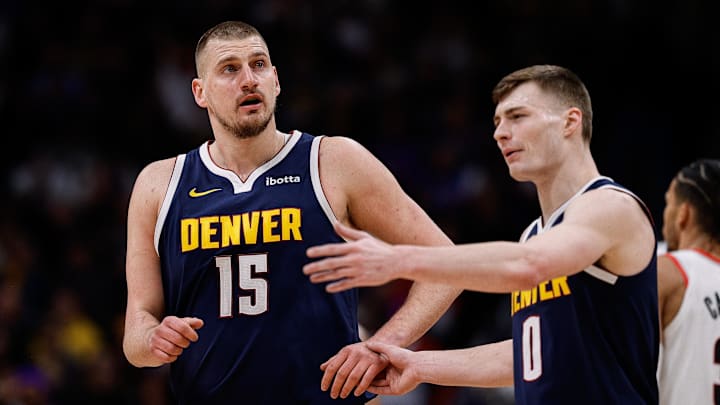 Feb 12, 2025; Denver, Colorado, USA; Denver Nuggets center Nikola Jokic (15) and guard Christian Braun (0) in the first quarter against the Portland Trail Blazers at Ball Arena. Mandatory Credit: Isaiah J. Downing-Imagn Images Feb 12, 2025; Denver, Colorado, USA; Denver Nuggets center Nikola Jokic (15) and guard Christian Braun (0) in the first quarter against the Portland Trail Blazers at Ball Arena. Mandatory Credit: Isaiah J. Downing-Imagn Images