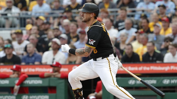 Jul 23, 2024; Pittsburgh, Pennsylvania, USA;  Pittsburgh Pirates catcher Yasmani Grandal (6) hits a single against the St. Louis Cardinals during the second inning at PNC Park. Mandatory Credit: Charles LeClaire-Imagn Images