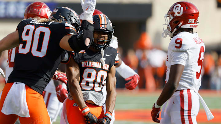 Oklahoma State Cowboys wide receiver Brennan Presley (80) celebrates with fullback Braden Cassity