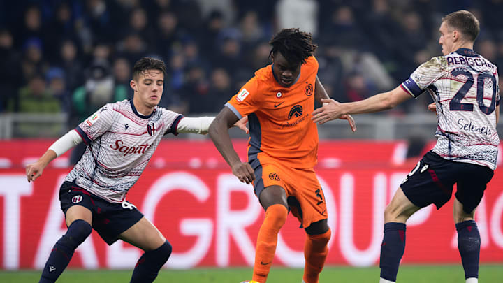 Yann Aurel Bisseck (C) of FC Internazionale competes for the...