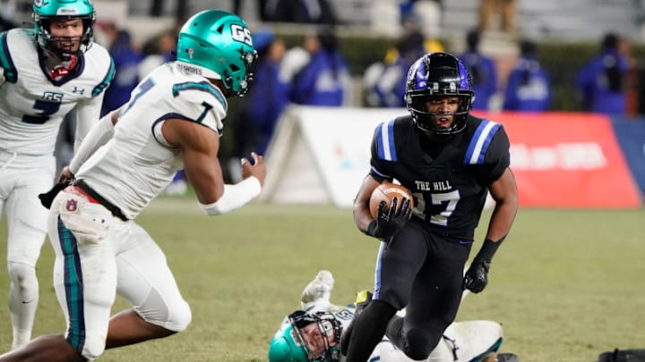 Ramsay   s Jayden Martin runs the ball and is pursued by Gulf Shores' Jamichael Garrett (7) during the 5A AHSAA State Championship Game in Bryant-Denny Stadium Thursday, Dec. 7, 2023.