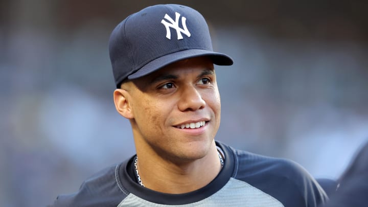 Jun 9, 2024; Bronx, New York, USA; New York Yankees right fielder Juan Soto (22) watches from the dugout during the third inning against the Los Angeles Dodgers at Yankee Stadium.