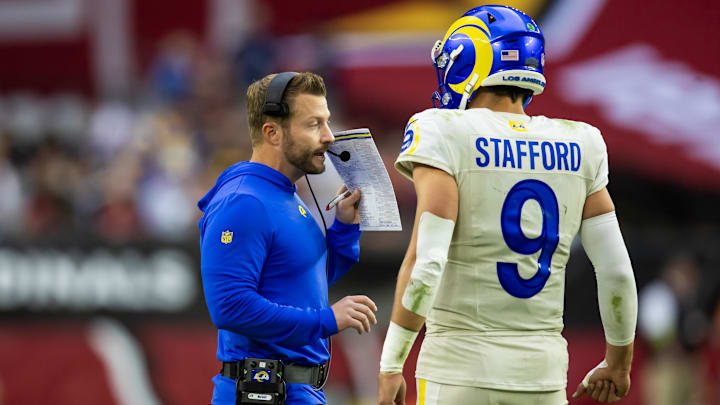 Nov 26, 2023; Glendale, Arizona, USA; Los Angeles Rams head coach Sean McVay talks with quarterback Matthew Stafford (9) against the Arizona Cardinals at State Farm Stadium. Mandatory Credit: Mark J. Rebilas-Imagn Images