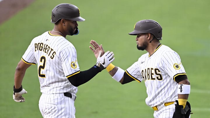 May 14, 2025; San Diego, California, USA; San Diego Padres shortstop Xander Bogaerts (2) is congratulated by Luis Arraez (4) after hitting three-run home run during the first inning against the Los Angeles Angels at Petco Park. Mandatory Credit: Denis Poroy-Imagn Images
