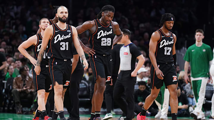 Mar 18, 2024; Boston, Massachusetts, USA; Detroit Pistons guard Evan Fournier (31), center Isaiah Stewart (28) and guard Stanley Umude (17) head to the bench during a timeout against the Boston Celtics in the first quarter at TD Garden. Mandatory Credit: David Butler II-Imagn Images