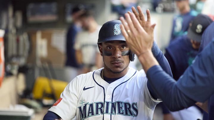 Jul 5, 2025; Seattle, Washington, USA; Seattle Mariners designated hitter Jorge Polanco (7) is greeted in the dugout after scoring against the Pittsburgh Pirates during the sixth inning at T-Mobile Park. Mandatory Credit: John Froschauer-Imagn Images Jul 5, 2025; Seattle, Washington, USA; Seattle Mariners designated hitter Jorge Polanco (7) is greeted in the dugout after scoring against the Pittsburgh Pirates during the sixth inning at T-Mobile Park. Mandatory Credit: John Froschauer-Imagn Images