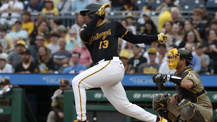 Pittsburgh Pirates third baseman Ke'Bryan Hayes (13) hits an RBI single against the San Diego Padres during the first inning at PNC Park. 