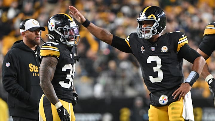 Oct 20, 2024; Pittsburgh, Pennsylvania, USA; Pittsburgh Steelers quarterback Russell Wilson (3) celebrates with running back Jaylen Warren (30) against the New York Jets during the fourth quarter at Acrisure Stadium. Mandatory Credit: Barry Reeger-Imagn Images