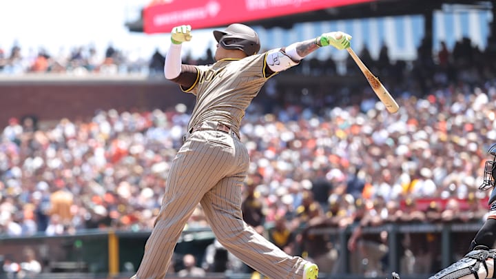 San Francisco, California, USA; San Diego Padres third baseman Manny Machado (13) hits a two-run home run against the San Francisco Giants during the third inning at Oracle Park.