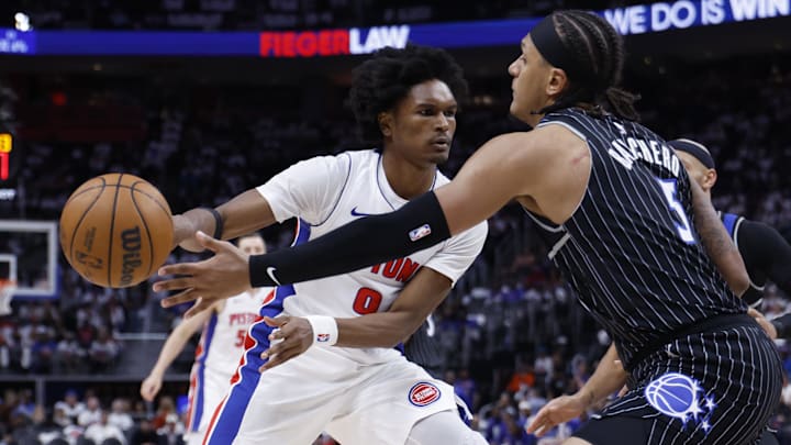 Apr 22, 2026; Detroit, Michigan, USA; Detroit Pistons guard Ausar Thompson (9) passes on Orlando Magic forward Paolo Banchero (5) in the second half during game two of the first round of the 2026 NBA Playoffs at Little Caesars Arena. Mandatory Credit: Rick Osentoski-Imagn Images