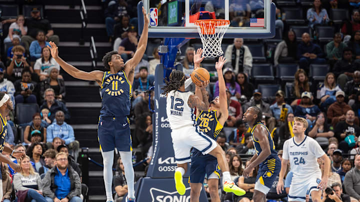 Oct 25, 2025; Memphis, Tennessee, USA; Memphis Grizzlies guard Ja Morant (12) shoots the ball between Indiana Pacers center James Wiseman (11) and guard Ben Sheppard (26) during the second half at FedExForum. Mandatory Credit: Wesley Hale-Imagn Images Oct 25, 2025; Memphis, Tennessee, USA; Memphis Grizzlies guard Ja Morant (12) shoots the ball between Indiana Pacers center James Wiseman (11) and guard Ben Sheppard (26) during the second half at FedExForum. Mandatory Credit: Wesley Hale-Imagn Images