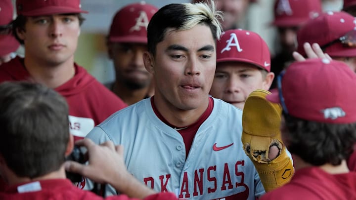 Arkansas infielder Wehiwa Aloy (9) celebrates after scoring a run during a NCAA baseball game against Georgia in Athens, Ga., on Friday, April 11, 2025.