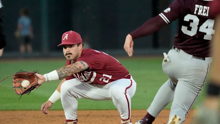 Alabama second baseman Brennen Norton (21) tags out Mississippi State base runner Gehrig Frei at Sewell-Thomas Stadium in Tuscaloosa Friday, April 11, 2025.