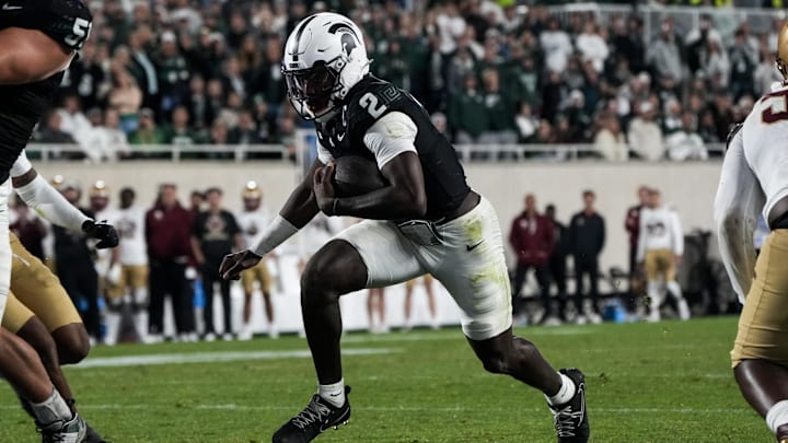 Sep 6, 2025; East Lansing, Michigan, USA; Michigan State quarterback Aidan Chiles (2) runs the ball into the end zone in double-overtime at Spartan Stadium. Mandatory Credit: Brendan Mullin-Imagn Images