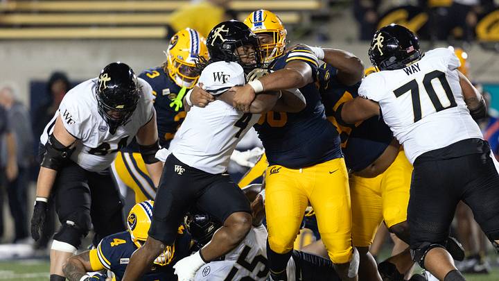 Oct 17, 2026; Berkeley, California, USA; California Golden Bears defensive lineman Derek Wilkins (96) tackles Wake Forest Demon Deacons running back Ty Clark III (4) during the second quarter at California Memorial Stadium. Mandatory Credit: D. Ross Cameron-Imagn Images Oct 17, 2026; Berkeley, California, USA; California Golden Bears defensive lineman Derek Wilkins (96) tackles Wake Forest Demon Deacons running back Ty Clark III (4) during the second quarter at California Memorial Stadium. Mandatory Credit: D. Ross Cameron-Imagn Images