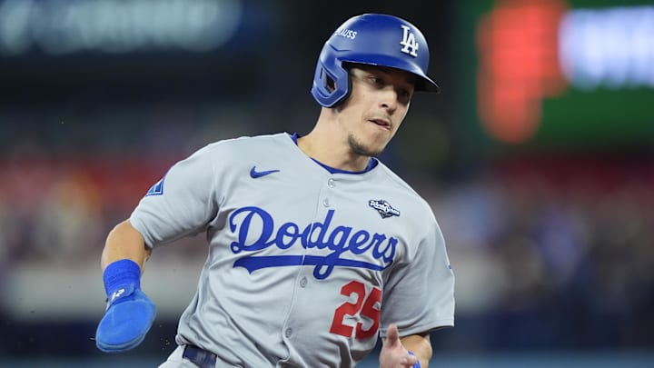 Oct 31, 2025; Toronto, Ontario, CAN; Los Angeles Dodgers second baseman Tommy Edman (25) runs home to score on a double by catcher Will Smith (16) in the third inning against the Toronto Blue Jays during game six of the 2025 MLB World Series at Rogers Centre. Mandatory Credit: John E. Sokolowski-Imagn Images