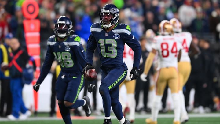Jan 17, 2026; Seattle, WA, USA; Seattle Seahawks linebacker Ernest Jones IV (13) reacts after an interception against the San Francisco 49ers during the second half in an NFC Divisional Round game at Lumen Field. Mandatory Credit: Steven Bisig-Imagn Images
