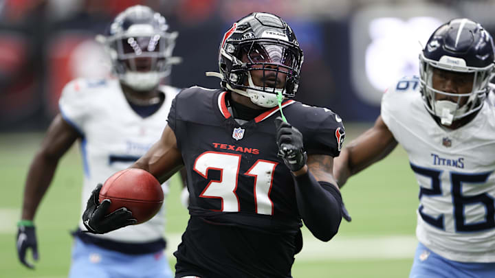 Nov 24, 2024; Houston, Texas, USA; Houston Texans special teams return man Dameon Pierce (31) returns the opening kick off for seventy yards against the Tennessee Titans in the first quarter at NRG Stadium.