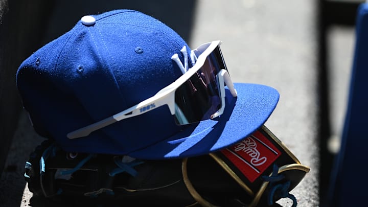 May 9, 2022; Baltimore, Maryland, USA;  A detailed view of Kansas City Royals hat and glove in the dugout during the first inning against the Baltimore Orioles at Oriole Park at Camden Yards. Mandatory Credit: Tommy Gilligan-Imagn Images