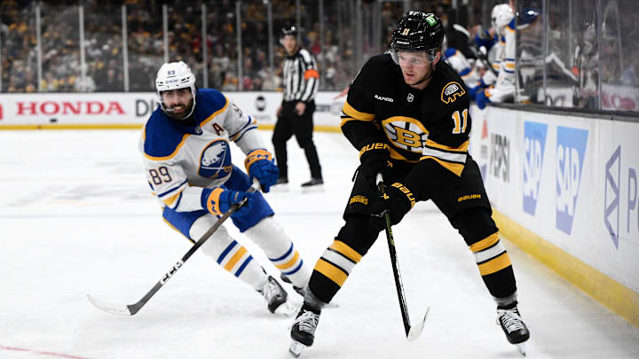 Apr 23, 2026; Boston, Massachusetts, USA; Boston Bruins center Casey Mittelstadt (11) controls the puck against Buffalo Sabres right wing Alex Tuch (89) during the third period of game three of the first round of the 2026 Stanley Cup Playoffs at the TD Garden. Mandatory Credit: Brian Fluharty-Imagn Images