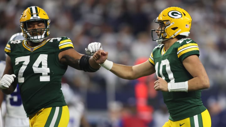 Green Bay Packers quarterback Jordan Love (10) reacts with guard Elgton Jenkins (74) during the playoff win at Dallas.