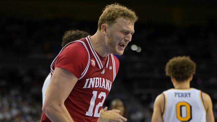 Jan 31, 2026; Los Angeles, California, USA; Indiana Hoosiers forward Tucker DeVries (12) reacts after UCLA Bruins forward Tyler Bilodeau (34) fouled Indiana Hoosiers forward Reed Bailey (1) as he shot a basket in the second half at Pauley Pavilion presented by Wescom Financial. Mandatory Credit: Jayne Kamin-Oncea-Imagn Images