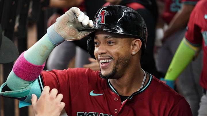 Aug 13, 2025; Arlington, Texas, USA; Arizona Diamondbacks second baseman Ketel Marte (4) is greet in the dugout after hitting a three-run home run during the ninth inning against the Texas Rangers at Globe Life Field. Mandatory Credit: Raymond Carlin III-Imagn Images