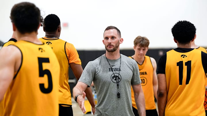Iowa men’s basketball assistant coach Connor Wheeler high-fives players during practice June 19, 2025 at Carver-Hawkeye Arena in Iowa City, Iowa.