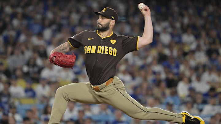 Oct 6, 2024; Los Angeles, California, USA; San Diego Padres pitcher Tanner Scott (66) pitches against the Los Angeles Dodgers in the eighth inning during game two of the NLDS for the 2024 MLB Playoffs at Dodger Stadium. 