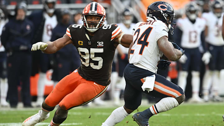 Myles Garrett turns former Bears back Khalil Herbert back in toward the line of scrimmage on a running play in 2023.