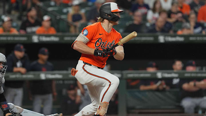 Sep 21, 2024; Baltimore, Maryland, USA; Baltimore Orioles shortstop Gunnar Henderson (2) drives in two runs during the ninth inning against the Detroit Tigers at Oriole Park at Camden Yards. 
