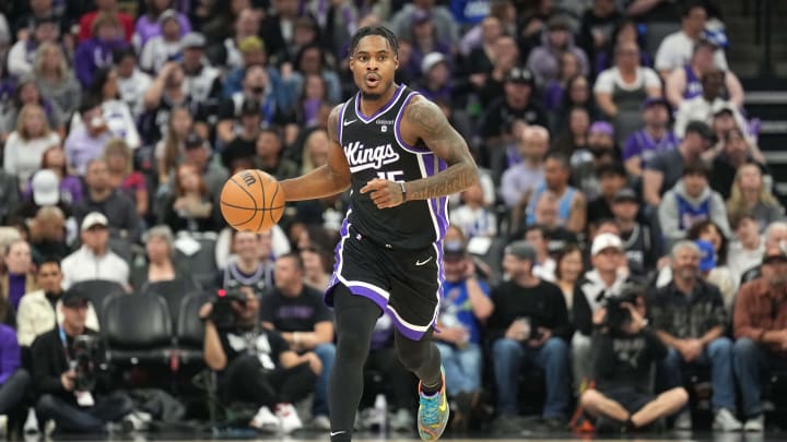 Mar 31, 2024; Sacramento, California, USA; Sacramento Kings guard Davion Mitchell (15) dribbles against the Utah Jazz during the first quarter at Golden 1 Center. Mandatory Credit: Darren Yamashita-USA TODAY Sports