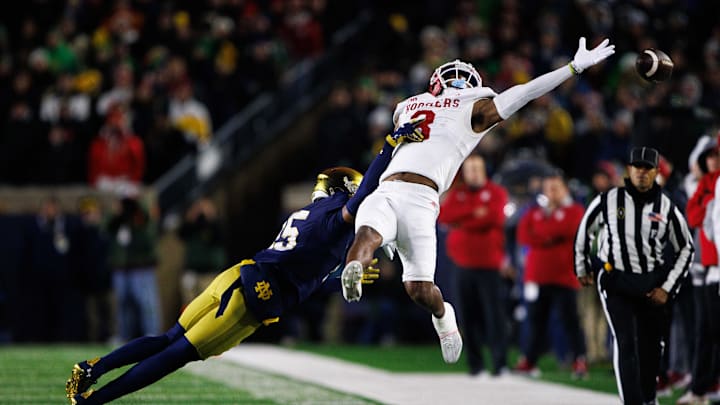 Notre Dame cornerback Leonard Moore (15) interrupts a reception attempt by Indiana wide receiver Omar Cooper Jr. (3) during the first round of the College Football Playoff between Notre Dame and Indiana on Friday, Dec. 20, 2024, in South Bend.