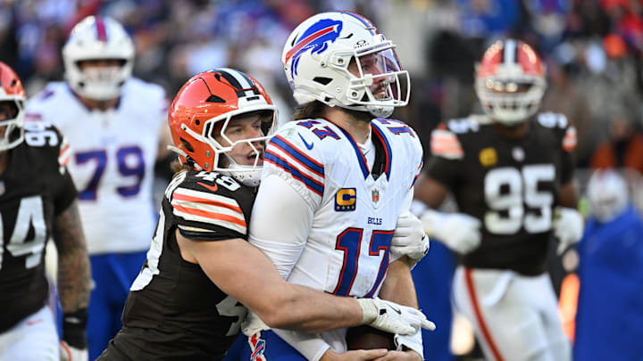 Dec 21, 2025; Cleveland, Ohio, USA;  Buffalo Bills quarterback Josh Allen (17) is sacked by Cleveland Browns linebacker Carson Schwesinger (49) during the second half at Huntington Bank Field.