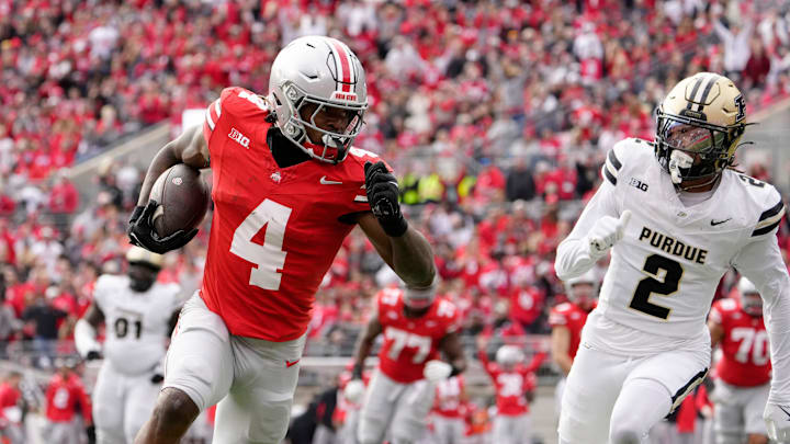 Nov 9, 2024; Columbus, Ohio, USA; Ohio State Buckeyes wide receiver Jeremiah Smith (4) dances into the end zone untouched by Purdue Boilermakers defensive back Nyland Green (2) during the first half at Ohio Stadium. Mandatory Credit: Barbara Perenic/USA TODAY Network via Imagn Images