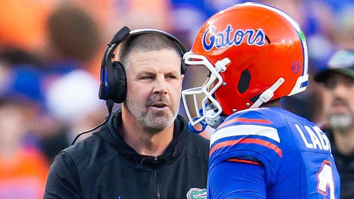 Florida Gators head coach Billy Napier talks with Florida Gators quarterback DJ Lagway (2) during the first half at Ben Hill Griffin Stadium in Gainesville, FL on Saturday, November 16, 2024. [Doug Engle/Gainesville Sun]