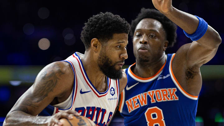 Jan 15, 2025; Philadelphia, Pennsylvania, USA; Philadelphia 76ers forward Paul George (8) drives against New York Knicks forward OG Anunoby (8) during the third quarter at Wells Fargo Center. Mandatory Credit: Bill Streicher-Imagn Images