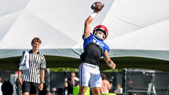 Oklahoma quarterback John Mateer catches a pass during practice.
