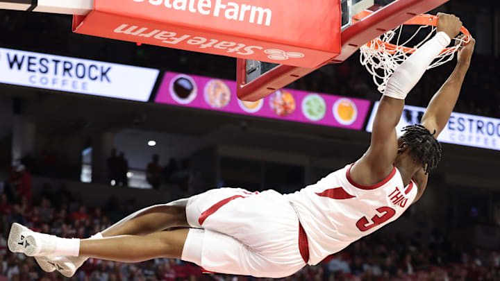 Arkansas Razorbacks forward Adou Thiero gets some serious hang time after dunking against the North Carolina A&T Aggies at Bud Walton Arena Saturday. Thiero had 17 points and 11 rebounds in the Hogs' 95-67 victory.