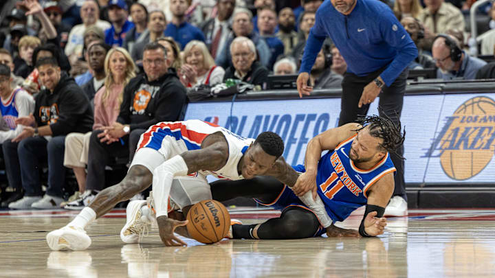 New York Knicks guard Jalen Brunson injures his leg battling for the loose ball with Detroit Pistons guard Dennis Schroder. Mandatory Credit: David Reginek-Imagn Images