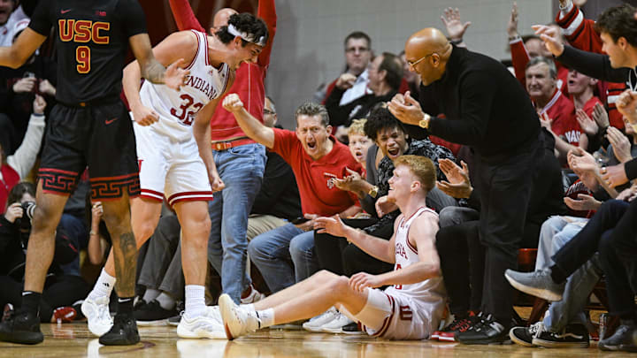 Indiana's Trey Galloway (32) and Luke Goode (10) celebrate after Goode (10) made a 3-pointer while being fouled by USC Wednesday at Assembly Hall.