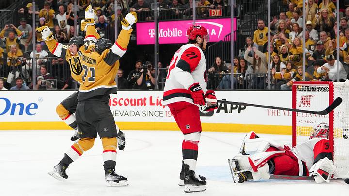 Jun 6, 2026; Las Vegas, Nevada, USA; Vegas Golden Knights right wing Mitch Marner (93) and center William Karlsson (71) celebrate after a goal by defenseman Shea Theodore (not pictured) as Carolina Hurricanes defenseman Alexander Nikishin (21) and goaltender Brandon Bussi (32) react during the second overtime in game three of the 2026 Stanley Cup Final at T-Mobile Arena. Mandatory Credit: Stephen R. Sylvanie-Imagn Images