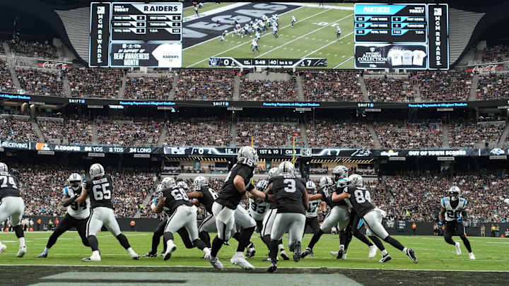 Sep 22, 2024; Paradise, Nevada, USA; A general overall view as Las Vegas Raiders quarterback Gardner Minshew (15) hands the ball off to running back Zamir White (3) against the Carolina Panthers in the first half at Allegiant Stadium. Mandatory Credit: Kirby Lee-Imagn Images
