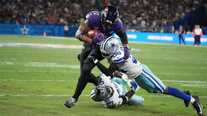 Sep 27, 2026; Rio De Janeiro, BRA; (Editors Notes: Caption Correction) Baltimore Ravens running back Derrick Henry (22) runs for a touchdown over Dallas Cowboys cornerback DaRon Bland (26) and linebacker Malachi Lawrence (57) during the first quarter at Maracana Stadium. Mandatory Credit: Kirby Lee-Imagn Images Sep 27, 2026; Rio De Janeiro, BRA; (Editors Notes: Caption Correction) Baltimore Ravens running back Derrick Henry (22) runs for a touchdown over Dallas Cowboys cornerback DaRon Bland (26) and linebacker Malachi Lawrence (57) during the first quarter at Maracana Stadium. Mandatory Credit: Kirby Lee-Imagn Images
