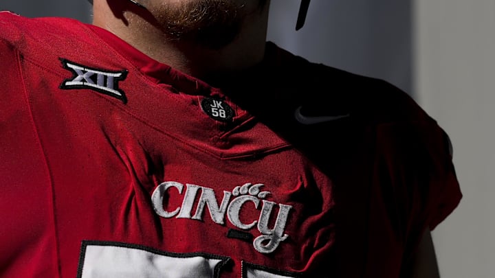 Oct 11, 2025; Cincinnati, Ohio, USA; The Cincinnati logo is seen on a player’s jersey before the game between the UCF Knights and the Cincinnati Bearcats at Nippert Stadium. Mandatory Credit: Aaron Doster-Imagn Images Oct 11, 2025; Cincinnati, Ohio, USA; The Cincinnati logo is seen on a player’s jersey before the game between the UCF Knights and the Cincinnati Bearcats at Nippert Stadium. Mandatory Credit: Aaron Doster-Imagn Images