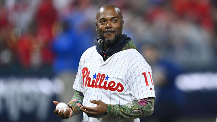 Nov 2, 2022; Philadelphia, Pennsylvania, USA; Former Philadelphia Phillies shortstop Jimmy Rollins and former second baseman Chase Utley look on prior to throwing out a ceremonial first pitch before game four of the 2022 World Series against the Houston Astros at Citizens Bank Park. Mandatory Credit: Kyle Ross-Imagn Images