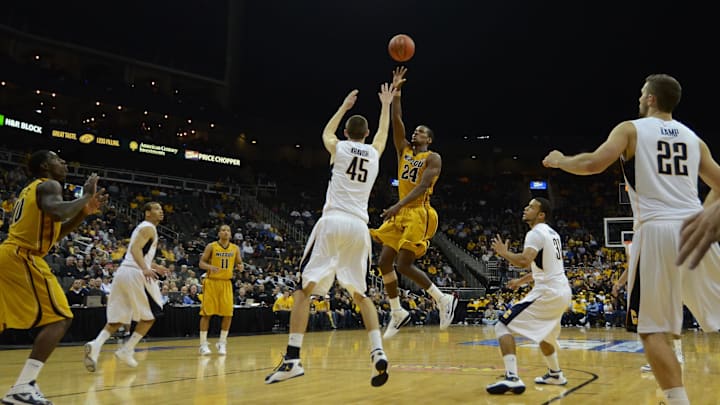 Nov 22, 2011; Kansas City, MO, USA; Missouri Tigers guard Kim English (24) takes a shot over California Golden Bears forward David Kravish (45) in the second half in the CBE Classic championship game at the Sprint Center. Missouri won the game 92-53. Mandatory Credit: John Rieger-USA TODAY Sports