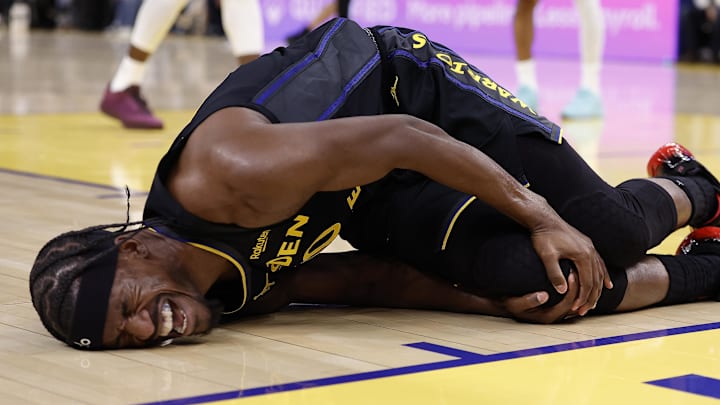 Jan 19, 2026; San Francisco, California, USA; Golden State Warriors forward Jimmy Butler III (10) holds his right knee as he goes down with an injury during the third quarter against the Miami Heat at Chase Center. Mandatory Credit: Kelley L Cox-Imagn Images